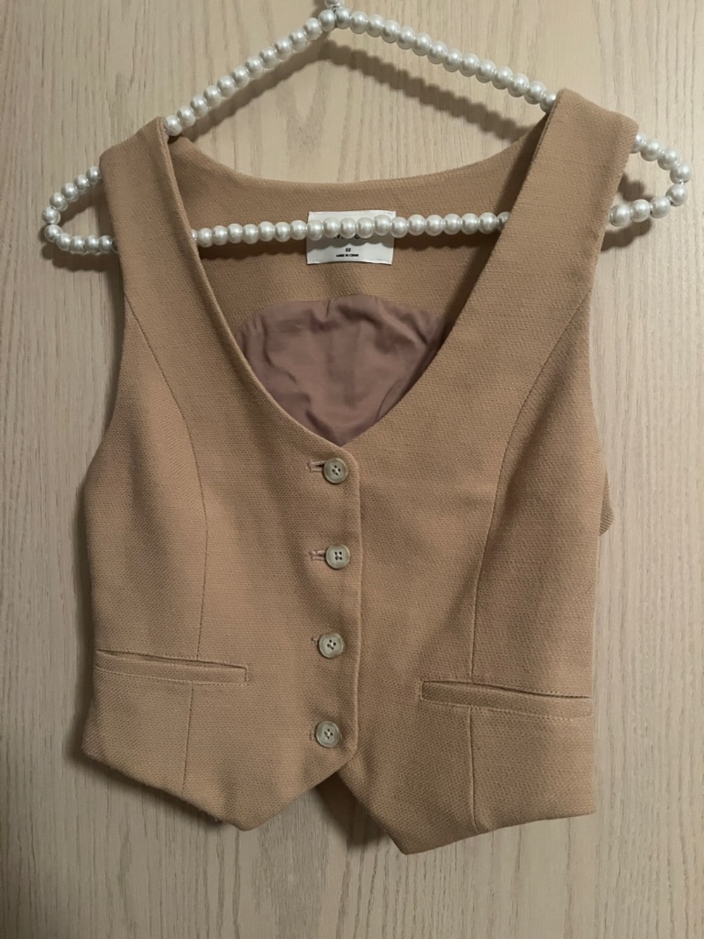 Wilfred Tan Sleeveless V-Neck Button Vest With a Pleated Skirt